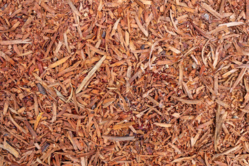 Full Frame Close-Up of Rough Brown Wood Chips Texture from Sawn Timber Waste for Natural Rustic...