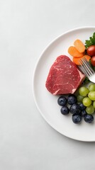 A beautifully arranged plate of gourmet food with a fork and knife elegantly placed beside it