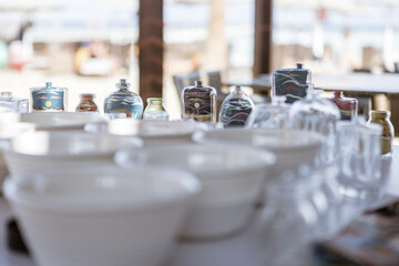 Colorful sand art bottles displayed on table in marsa alam, egypt