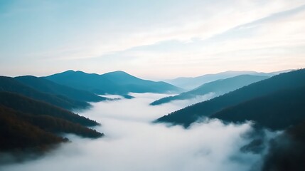 Fototapeta premium Serene Mountain Landscape with Lush Green Hills and Soft Mist Blanketing the Valley at Sunrise