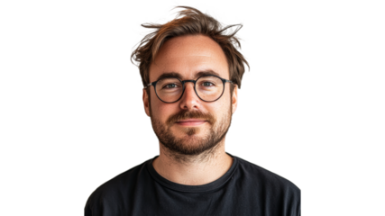 Man in glasses poses casually indoors