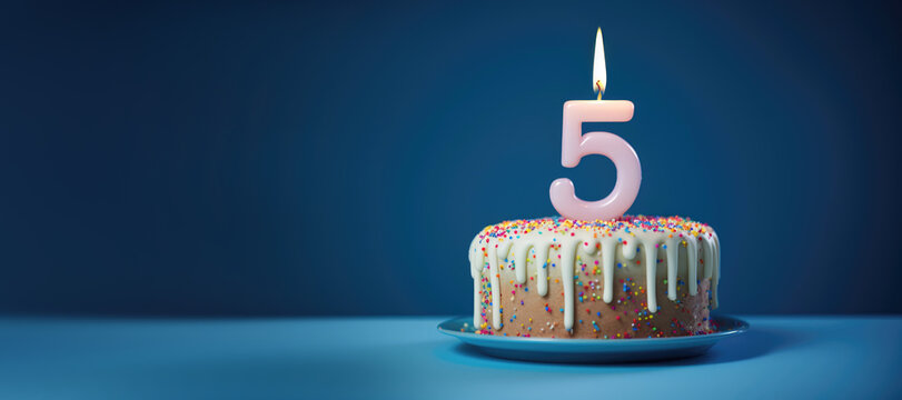 A delicious birthday cake adorned with colorful frosting and candles celebrates 5th birthday