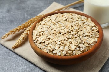 Happy Easter. Colorful eggs, bunny ears and yellow flowers on a pastel color background, space for text or advertising