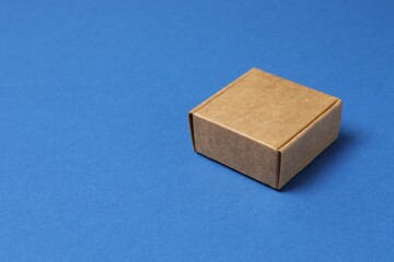 Cardboard box on blue background