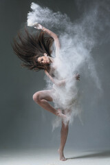 Dancing in flour dancer posing on a studio background