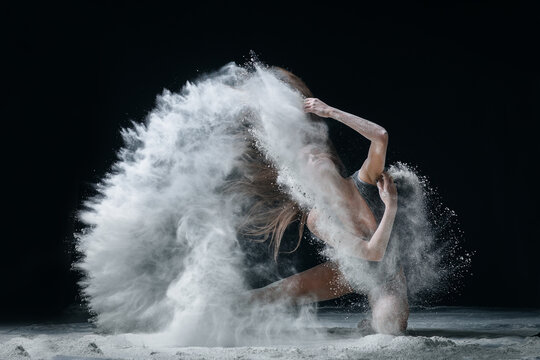 Dancing in flour dancer posing on a studio background