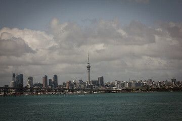 Naklejka premium Retro style photo of a view over Auckland Harbour and a skyline of Auckland City from a suburb of Birkinhead. North Island, New Zealand