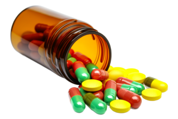 Capsules and tablets spilling from a bottle