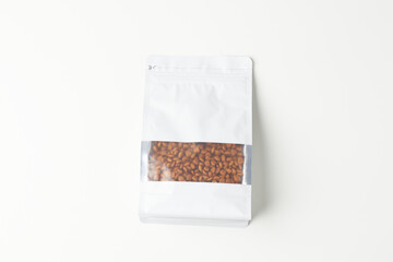 Bag of Roasted Coffee Beans With Transparent Window on a Plain Background