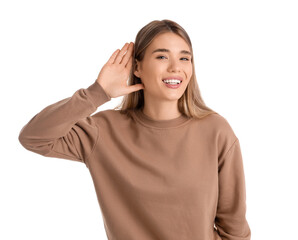 Young woman trying to hear something on white background
