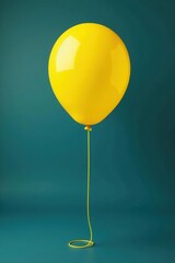 Yellow balloon tied to a pole with a long string unwinding from it, relax