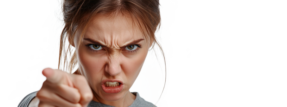 A young woman with an angry facial expression and pointing a finger at the camera. Transparent background