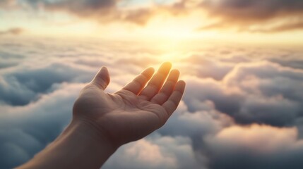 Reaching Hand Towards Bright Sunrise Above Soft Cloud Cover