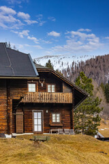 Rustic Cabin in Snowy Mountain Landscape