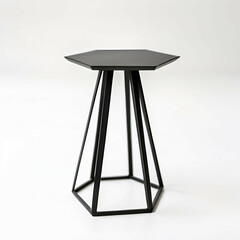 Naklejka premium Geometric Side Table: A small, polygonal metal side table with a matte black finish, displayed on a white background. 