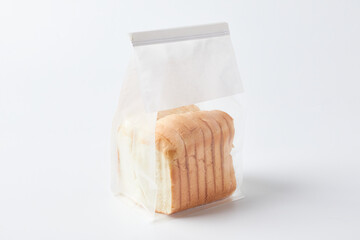 Sliced Bread Packaged in a Transparent Bag on a Plain Background in a Food Setting
