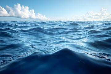 Fototapeta premium Vast Blue Ocean Water Surface with White Clouds and Sunlight Reflection on Ripples Under Clear Sky Scenery with Waves and Natural Texture