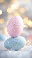 Obraz premium A beautiful arrangement of pastel pink and blue Easter eggs with golden specks, set against a soft, blurred background, Ideal for spring-themed projects, cards, or social media celebrations,