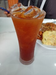 Iced tea is served in glass glasses