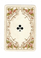An antique clubs playing card on a white background.