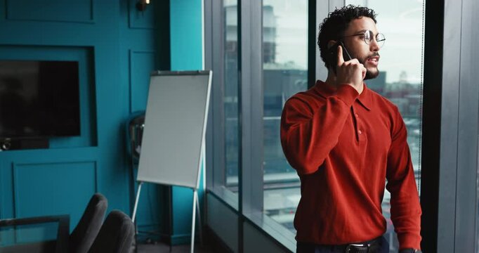 Businessman, discussion and window with phone call for proposal, conversation or negotiation in boardroom. Happy man, financial advisor or salesperson talking with mobile smartphone for chat or deal