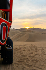 Dessert sunset with buggy wheel 