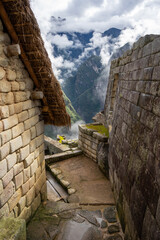Machu Picchu cloudy view between buildings