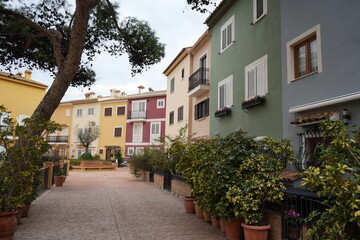 Charming pedestrian street with colorful Mediterranean houses, Port Saplaya, Valencia