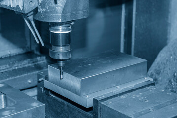 The operation of edge finder for center setup for CNC milling machine. © Pixel_B