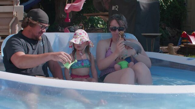 Family in a kiddy Blow Up Pool