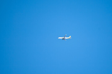 flying plane against blue sky