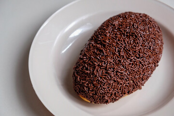 Close-up of bread with chocolate sprinkles.