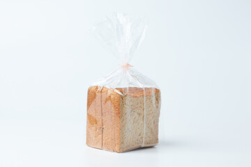 Freshly Packaged Sliced Bread in Transparent Plastic Bag on a Clean Surface