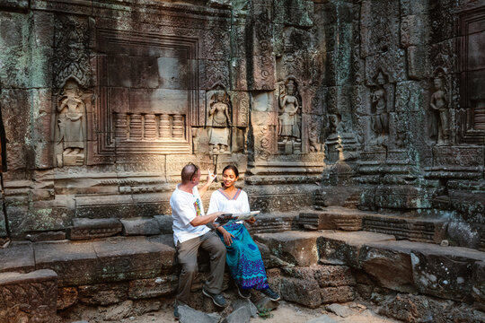 Man and woman inside a temple, Angkor, Cambodia