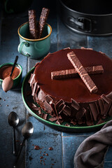 Tasty chocolate cake made of milk, nuts and glaze.