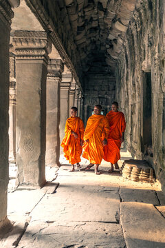 Three buddhist monks at Angkor Wat, Siem Reap, Cambodia