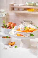 Sweet peach meringue made of fruit and whipped cream.