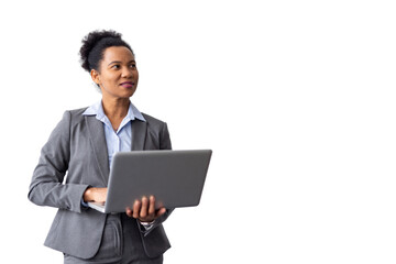 Efficient African American businesswoman reviewing files on a laptop while standing