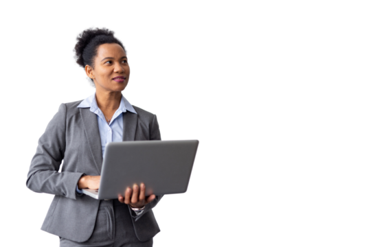 Efficient African American businesswoman reviewing files on a laptop while standing