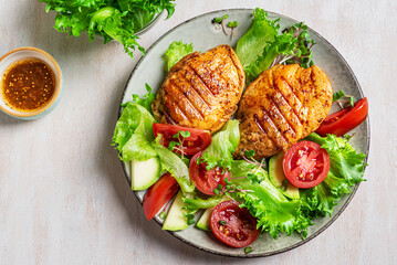 Grilled chicken breast and vegetable salad