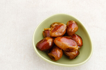 Kurma Sukari or Sukkari Dates Fruit,  Served in bowl. Top view
