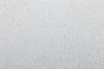 gray and white cement wall background. Background for wallpaper or graphic design. Blank plaster texture in vintage style.