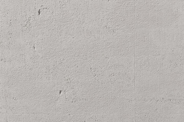 White cement wall in retro concept. Background for wallpaper or graphic design. Blank plaster texture in vintage style. Modern house interiors that feel calm and simple.