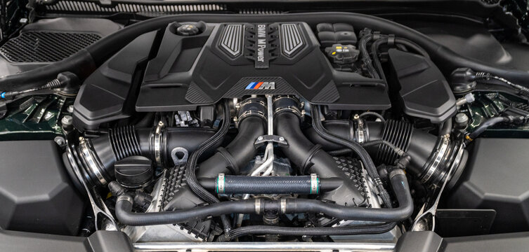 Bmw M Power gasoline engine. V8 twin turbo engine of BMW M5 Competition under vehicle hood. Engine motor of BMW M5 Competition with emblem. Open bonnet. 