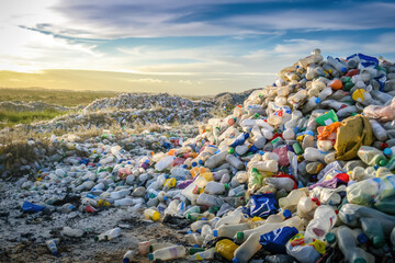 Massive piles of plastic bottles in a landfill highlighting environmental pollution issues