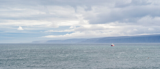 A fishing vessel at the coast of Barents Sea just outside of the village of Berlev&aring;g in Northern Norway