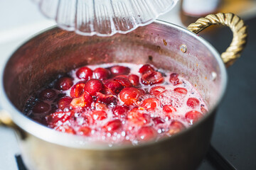 pouring whiskey into jam,homemade healthy jam