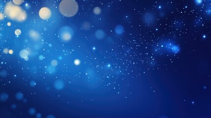 Abstract blue background with sparkling glitter and bokeh effect creating festive atmosphere