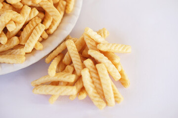 Prawn cracker sticks, Shrimp crisp rice snack on white background. Concept, delicious traditional crunchy food snack appetizer.         