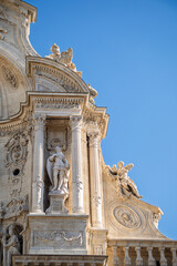 Obraz premium Vertical detail of the newly restored sculptural facade of the Cathedral of Santa María in the city of Murcia, Spain